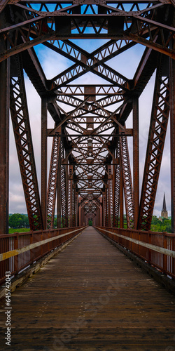 Fototapeta Naklejka Na Ścianę i Meble -  Fredericton Railway Bridge or Bill Thorpe Walking Bridge over St John River in New Brunswick, Canada