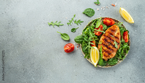 Grilled chicken breast with tomatoes and herbs, Healthy, clean eating. place for text, top view