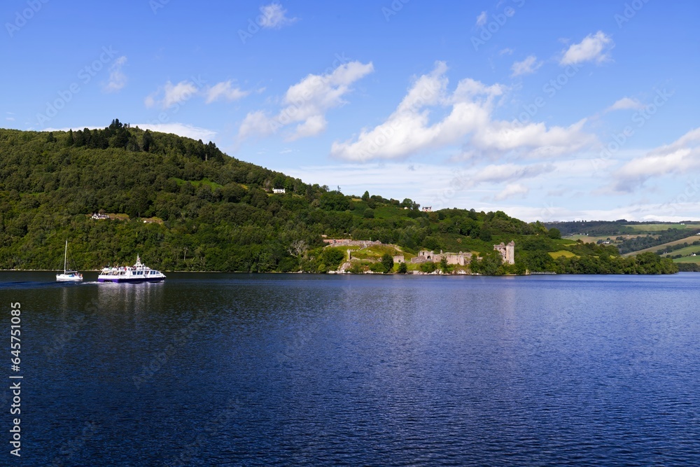 Sailing Through Legends: Passenger Ship En Route to Urquhart Castle on Loch Ness