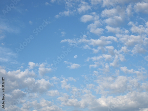 cloudy blue sky with moon background