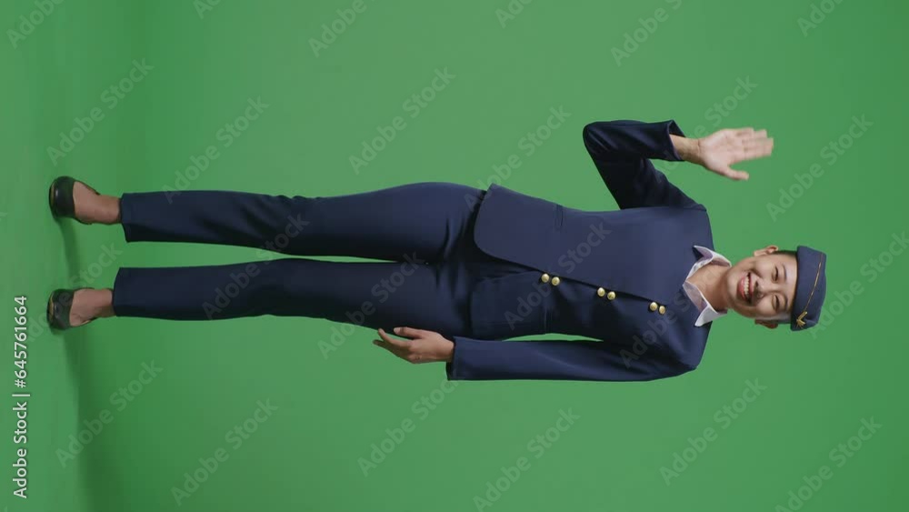 Full Body Of Asian Woman Air Hostess Smiling, Waving Hand, And Saying Bye While Standing In The Green Screen Background Studio
Full Body Of Asian Woman Air Hostess Smiling, Waving Hand, And Saying Bye While Standing In The Green Screen Background Studio
