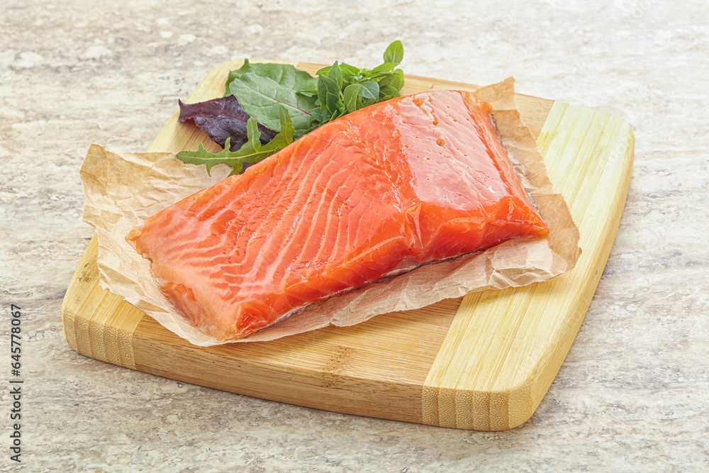 Raw salmon fillet over board Raw salmon fillet over board