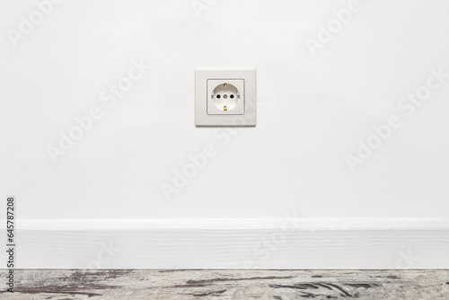 White outlet on white wall