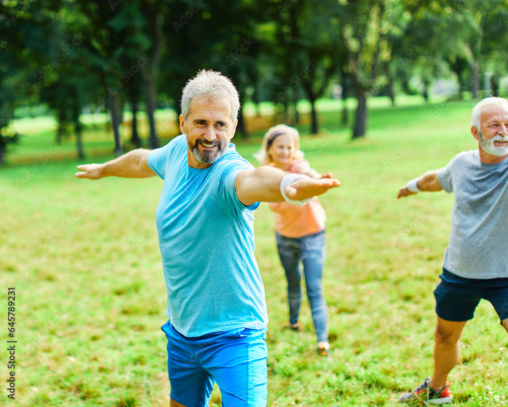 Fototapeta premium outdoor senior fitness woman man lifestyle active sport exercise healthy fit retirement stretching elderly couple training class clothing