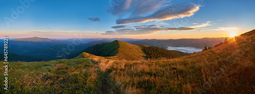Beautiful sunrise in the mountains. Panorama of summer landscape in the Carpathian Mountains