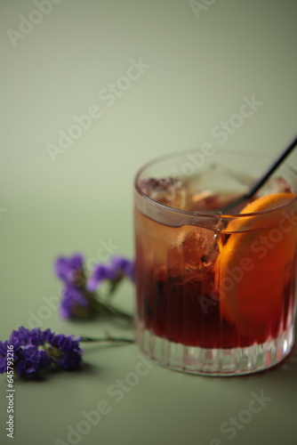 Whiskey in glass with flowers