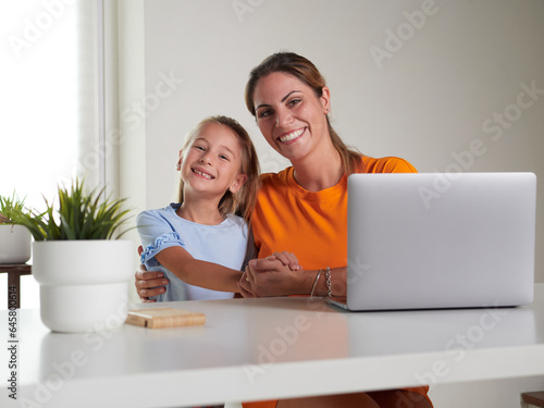 happy mother and daughter at home