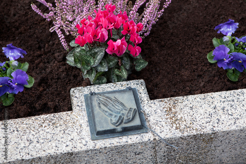 Holy water shell at the grave photo