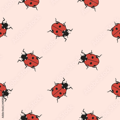 Beautiful seamless pattern of ladybug beetles on pink background. Look other samples in collection