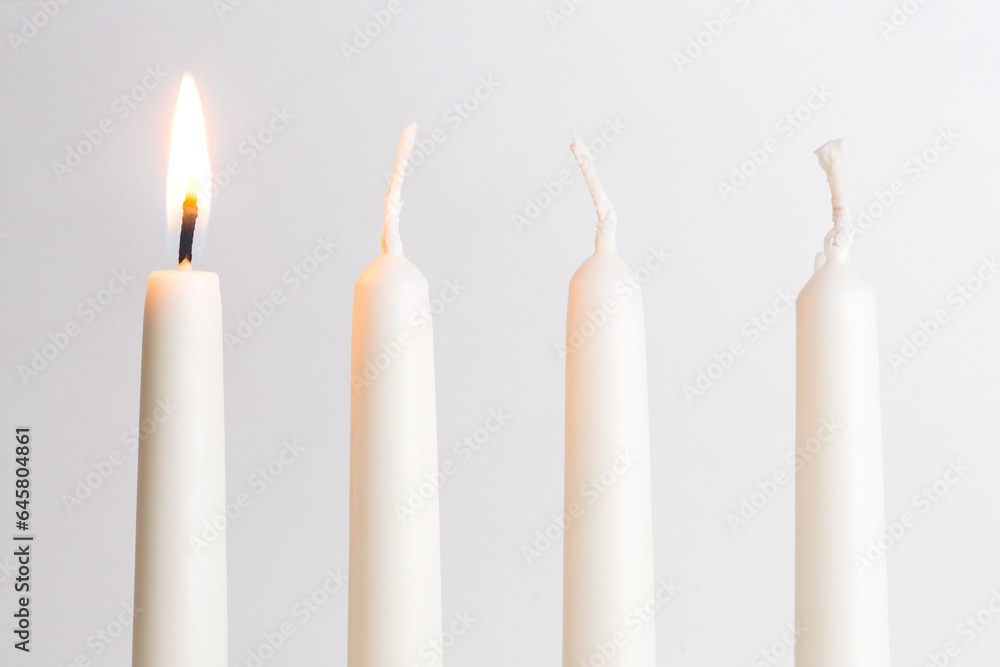 First candle on an advent wreath First candle on an advent wreath