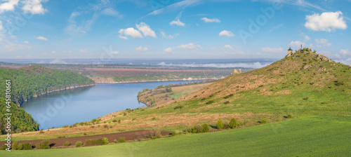 Ukraine without russian aggression. Amazing spring view on the Dnister River Canyon with picturesque rocks, fields, flowers. This place named Shyshkovi Gorby, Nahoriany, Chernivtsi region, Ukraine.