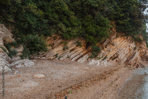 rocky mountain coast descends to a sea bay at sunset in Montenegro