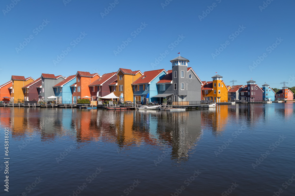Colorful promenade and pier houses at the Reitdiephaven in Groningen.