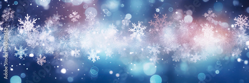 Defocused Christmas background with snowflakes and bokeh lights. 