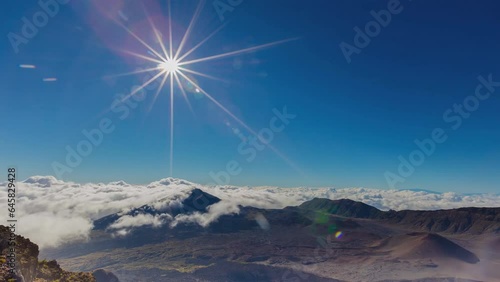 Sunset above the clouds over 3000 meters at the Haleakala Volcano, Maui, Hawaii (time-lapse) photo