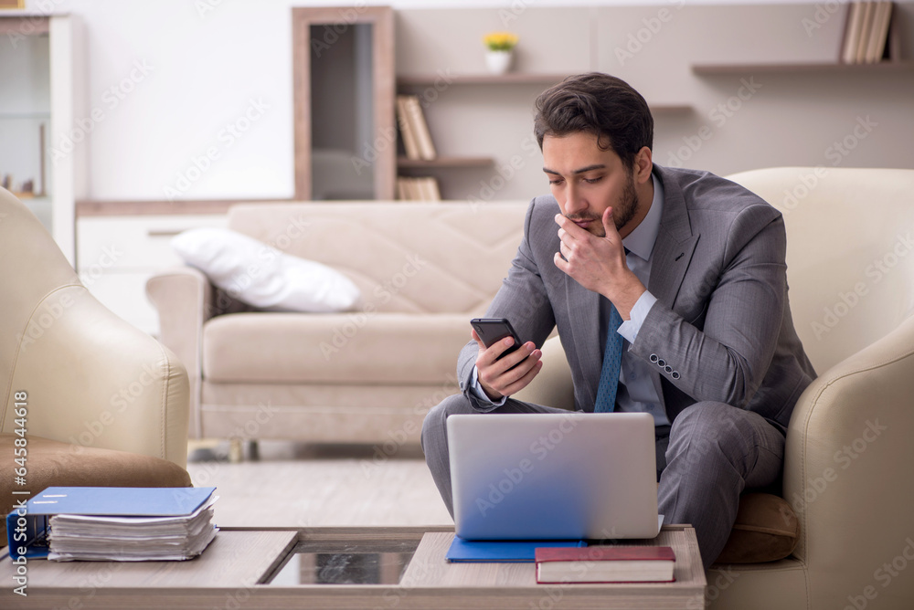Young male employee working from home Young male employee working from home