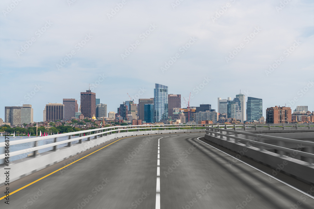 Empty urban asphalt road exterior with city buildings background. New modern highway concrete construction. Concept of way to success. Transportation logistic industry fast delivery. Boston. USA.