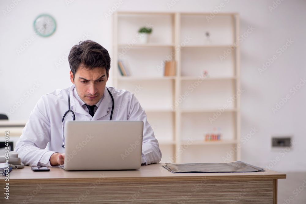 Young male doctor in telemedicine concept Young male doctor in telemedicine concept