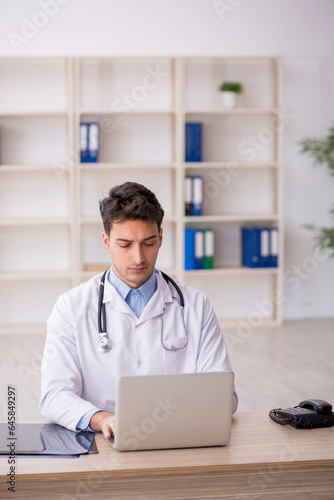 Young male doctor in telemedicine concept