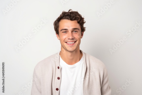 Medium shot portrait photography of a French man in his 20s against a white background © Anne Schaum