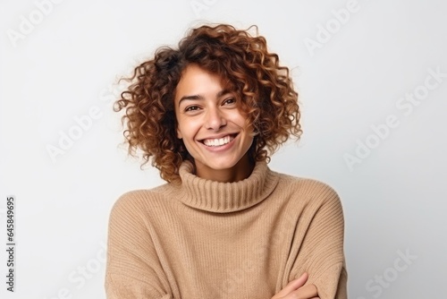 Medium shot portrait photography of a French woman in her 30s wearing a cozy sweater against a white background