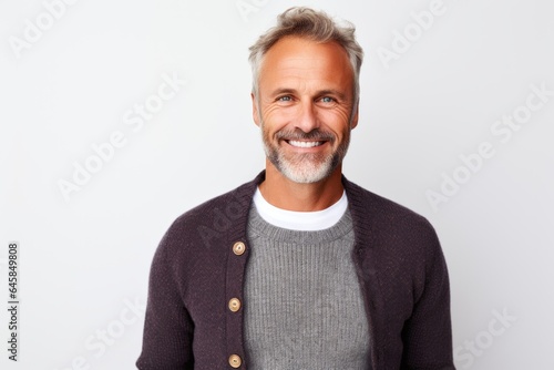 Lifestyle portrait photography of a French man in his 40s against a white background photo