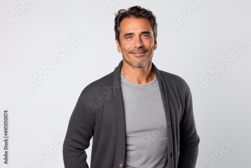 Portrait photography of a Colombian man in his 40s against a white background