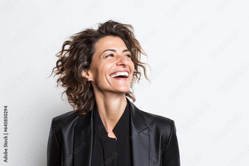 Lifestyle portrait photography of a Italian woman in her 40s wearing a sleek suit against a white background Lifestyle portrait photography of a Italian woman in her 40s wearing a sleek suit against a white background
