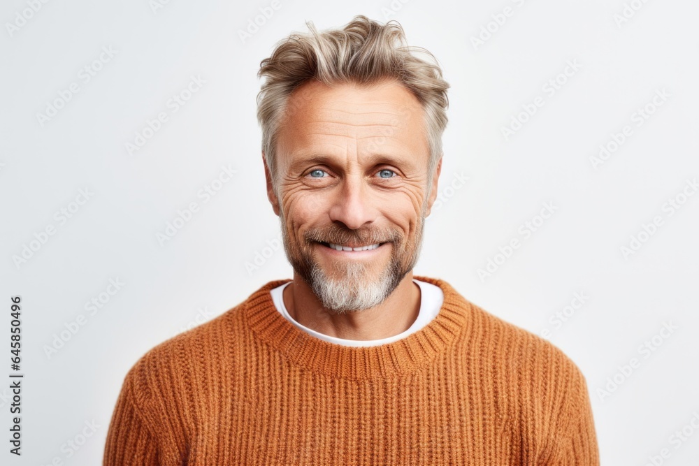 Obraz premium Medium shot portrait photography of a Swedish man in his 40s wearing a cozy sweater against a white background