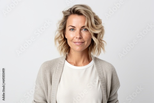 Medium shot portrait photography of a Swedish woman in her 30s against a white background