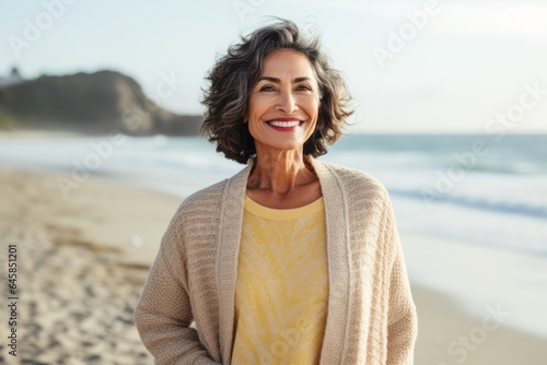 Portrait photography of a Colombian woman in her 60s against a beach background
