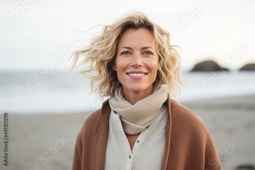 Medium shot portrait photography of a Swedish woman in her 40s against a beach background