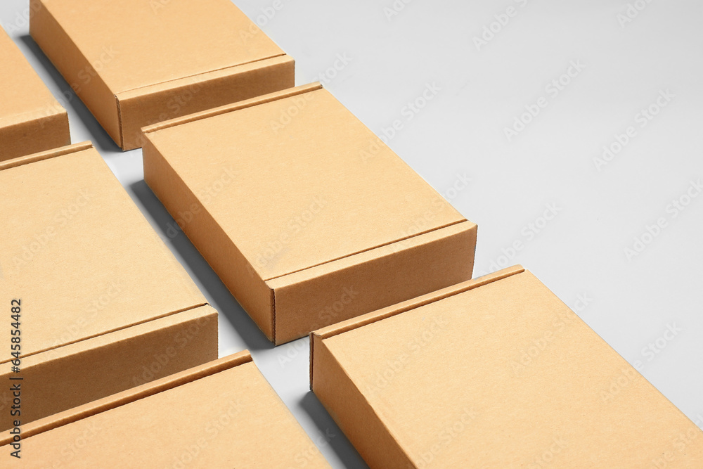 Many cardboard boxes on white background, space for text. Packaging goods