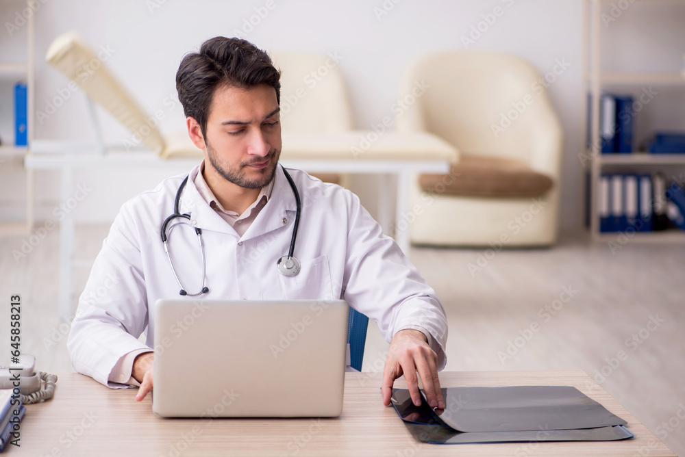 Young male doctor radiologist working in the clinic Young male doctor radiologist working in the clinic