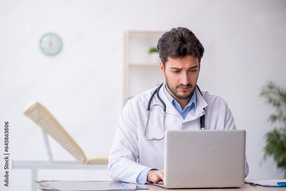 Young male doctor in telemedicine concept Young male doctor in telemedicine concept