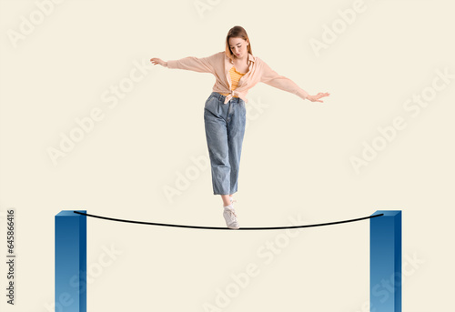 Obraz na plátně Young woman balancing on white background