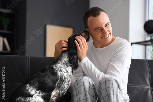Young man with cute cocker ...