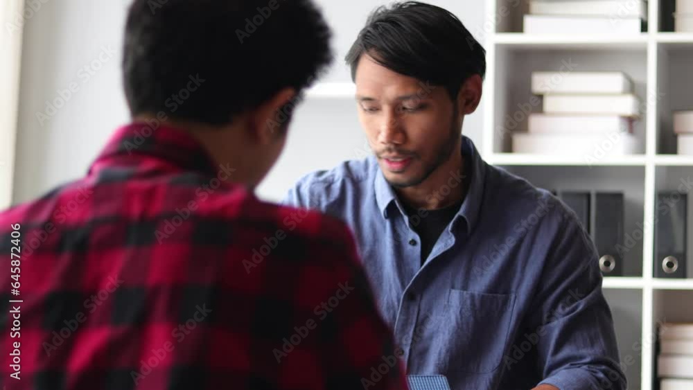 Architect colleagues discussing building blueprint design and construction project planning. Architect colleagues discussing building blueprint design and construction project planning.