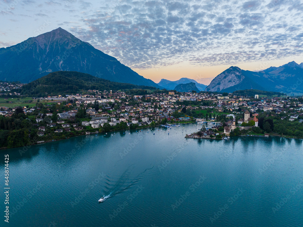 Naklejka premium The Village of Spiez at lake Thun in front of mount Niesen, at sunrise, Switzerland