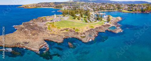 Panoramic aerial drone view at Kiama on the New South Wales South Coast, Australia showing Kiama Lighthouse on a sunny day 