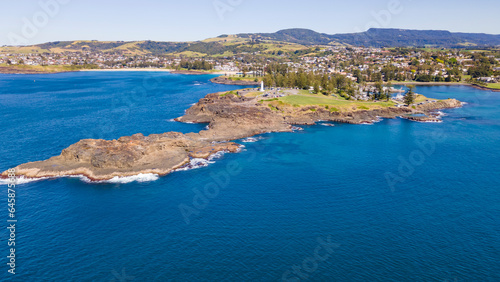 Panoramic aerial drone view at Kiama on the New South Wales South Coast, Australia showing Kiama Lighthouse on a sunny day 