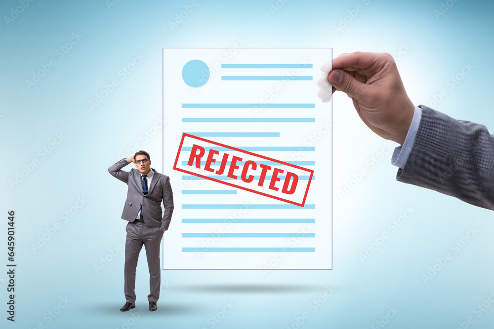 Man receiving rejection notice on his cv Man receiving rejection notice on his cv