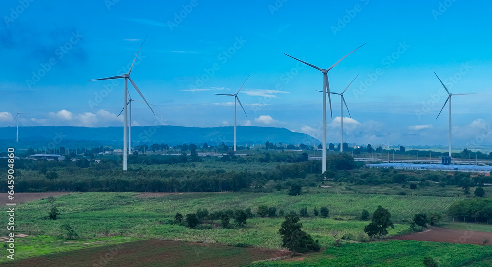 The wind turbines generating electricity with blue sky - Alternative renewable energy concept