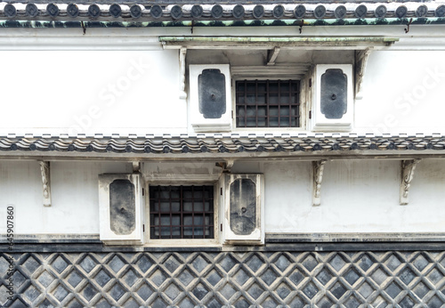 Tiled Japanese traditional namako wall of old traditional Japanese building photo
