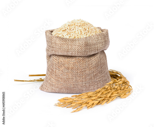 Brown rice in sack bag isolated on white photo