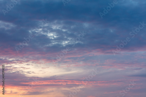 Pink blue clouds at sunset as background