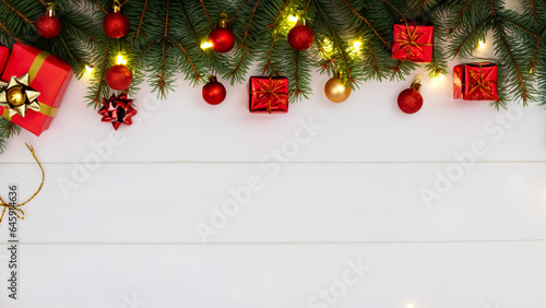 Bright decorative Christmas background. New year spruce sprigs, garland light. Bright winter holiday banner with copy space for text placement. Traditional background decor.