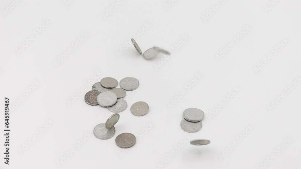 Indonesian rupiah coins falling in white background Indonesian rupiah coins falling in white background