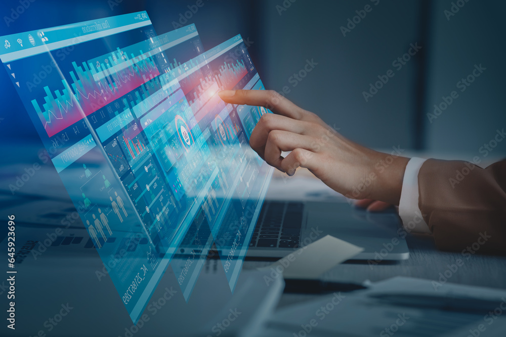 Technology and financial advisory services concept. Business hands working on digital laptop or tablet computer with business analysis and data management system for finance, Digital marketing.