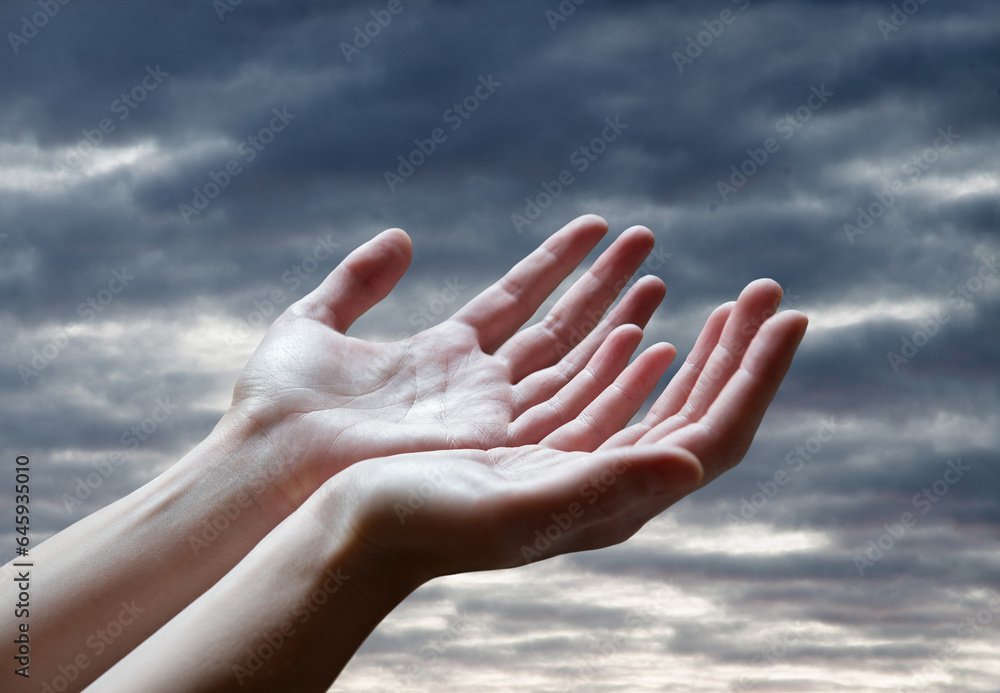 The outstretched hands of a praying man The outstretched hands of a praying man